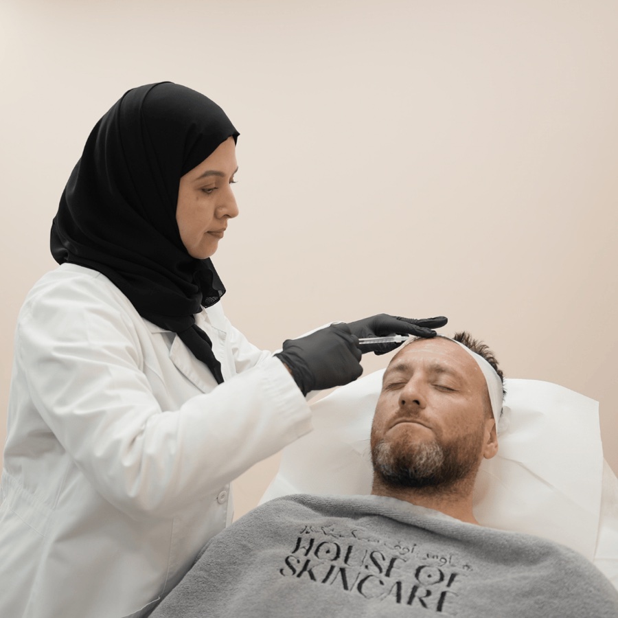 Dr. Khadija Al-Zaabi administering botox injection — natural results, House of Skincare Abu Dhabi